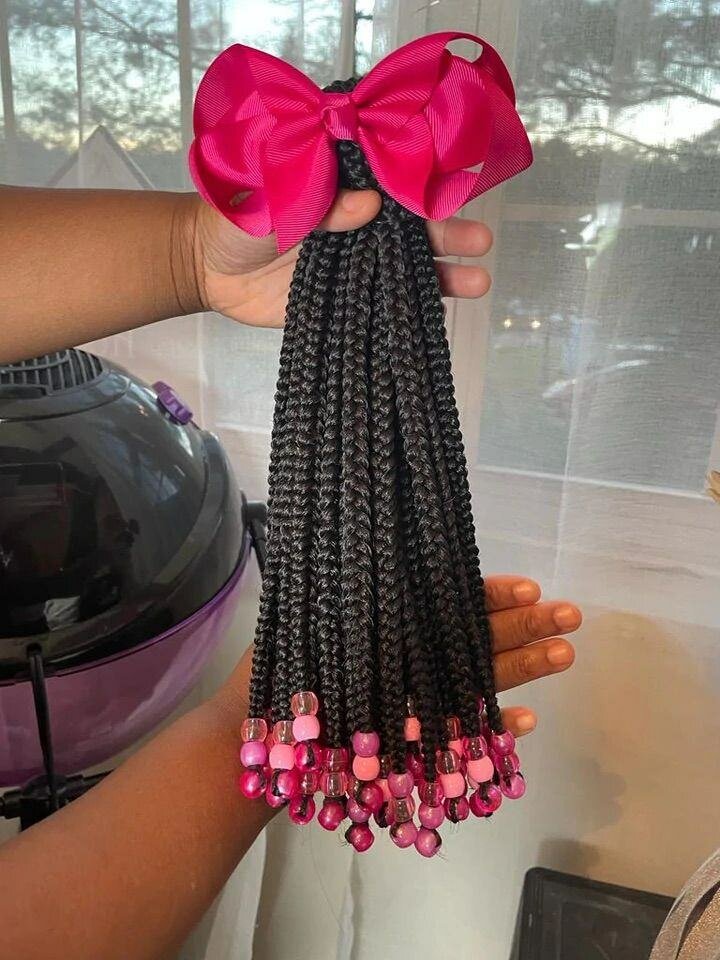 Extensions tressées avec perles