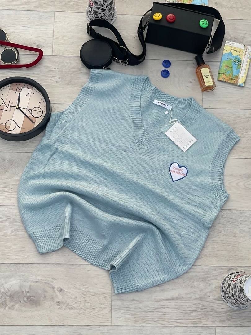 Pull sans manches coeur femme