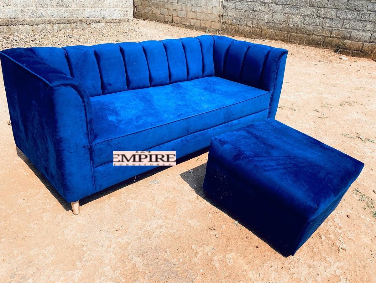 Sofa and ottoman with blue upholstery