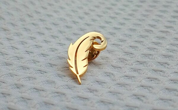 Feather lapel pin
