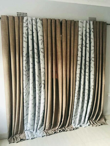 2 drops of curtains light brown and white