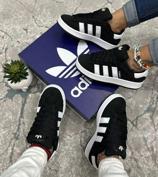 Sneakers noirs à rayures blanches