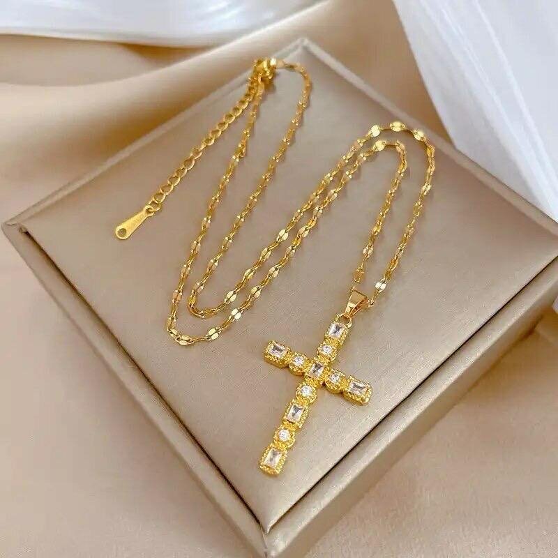 Chain with a cross pendant made of zirconium, golden color