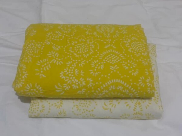 Yellow and white bed linen with floral pattern