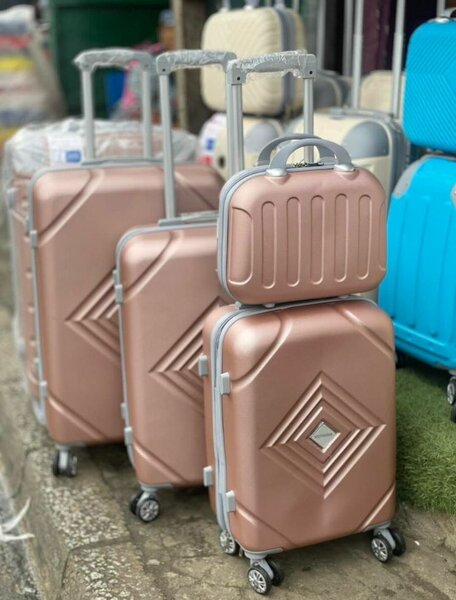 Valise à roulettes rose