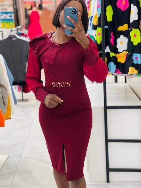 Red dress, fitted, decorated with rhinestones