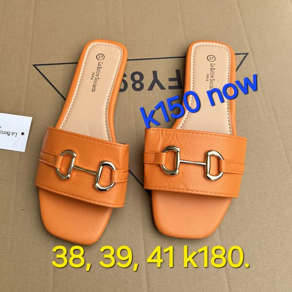 Orange patent leather flip-slops with gold hardware