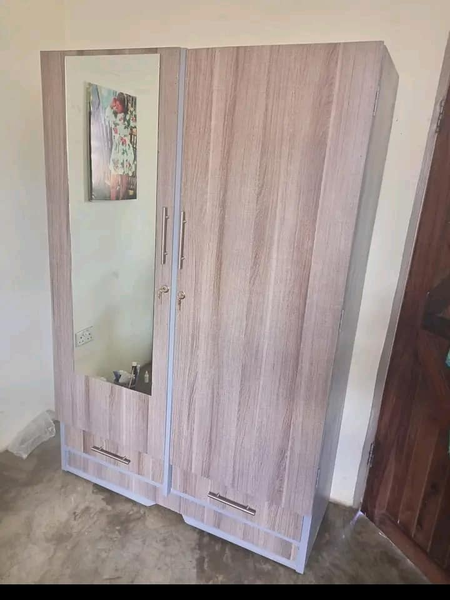 light brown two-leaf wardrobe with mirror