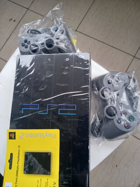 Ps2 fat+2manettes 27 jeux