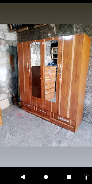 light brown cabinet with two mirrors