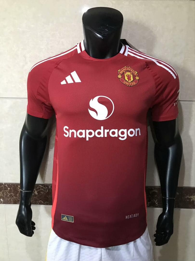 Manchester United men's soccer uniform in red, with Adidas and Snapdragon logos