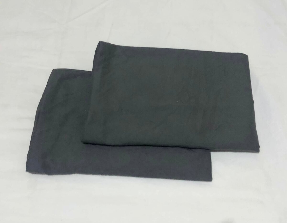 Grey textiles, perhaps pillowcases or sheets.