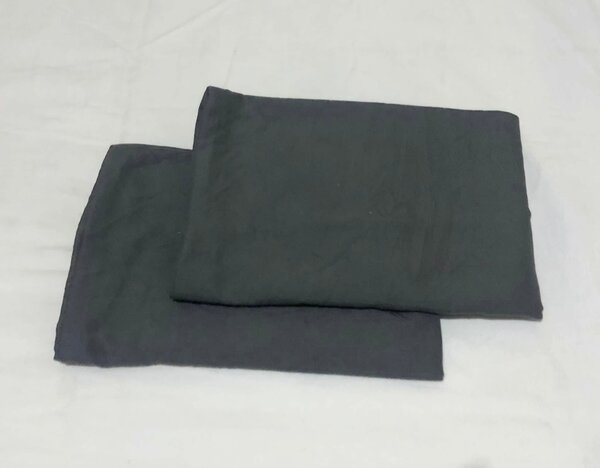 Grey textiles, perhaps pillowcases or sheets.