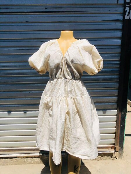 A lush milky dress with lantern sleeves