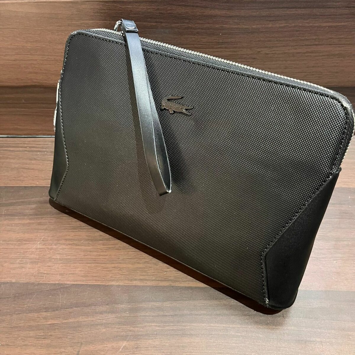 Lacoste leather pouches