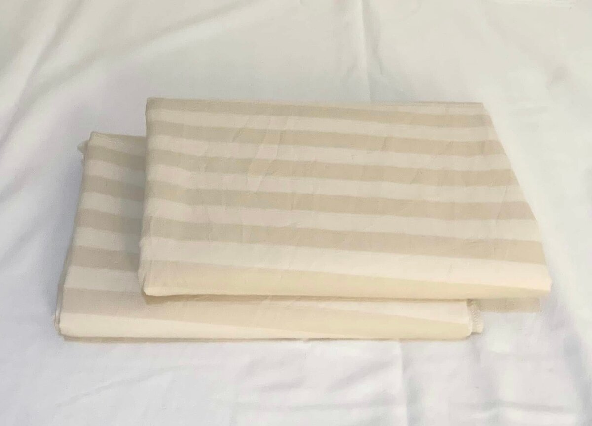 Beige striped bed linen.