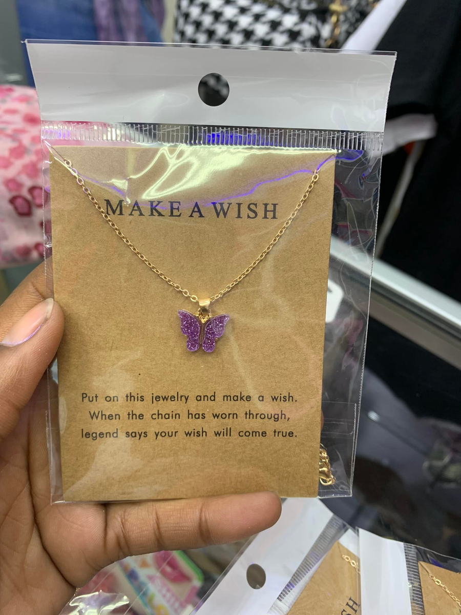 Pendant with violet butterfly