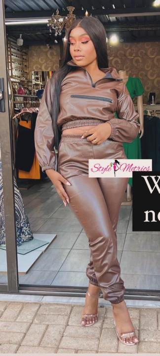 Brown women's suit, trousers and a short top with long sleeves