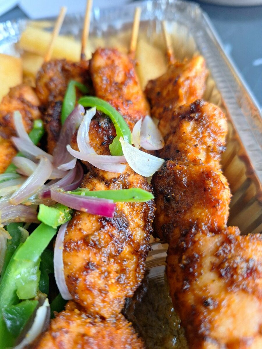 Jollof With Grilled Chicken khebabs