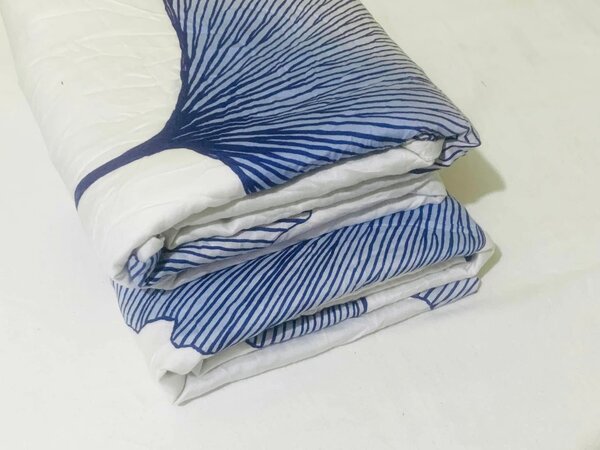 A sheet with a blue abstract pattern on a white background