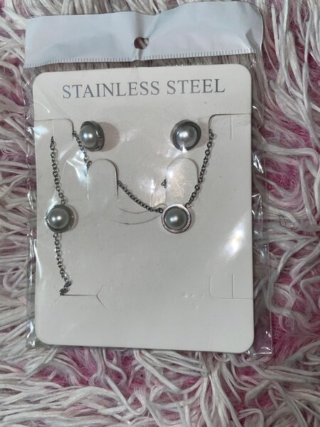 Parure acier croix moderne