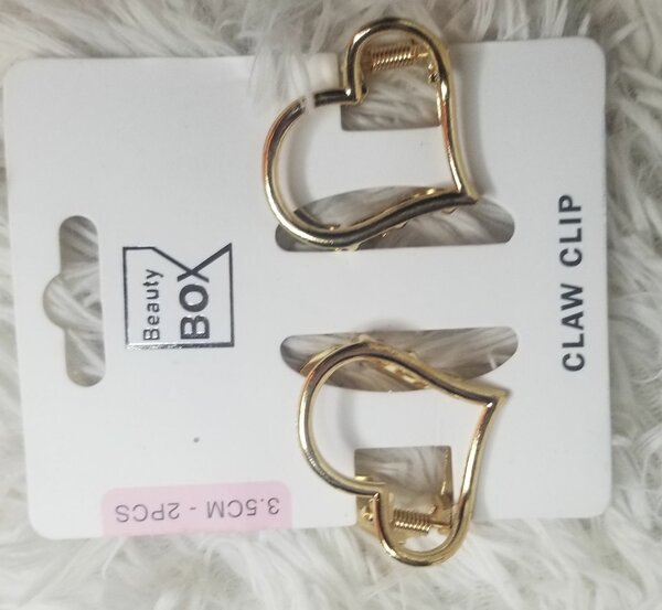 Clips en cœur dorés