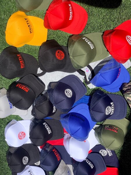 Hustle and Motivate caps k65