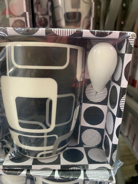 Ceramic cup with spoon