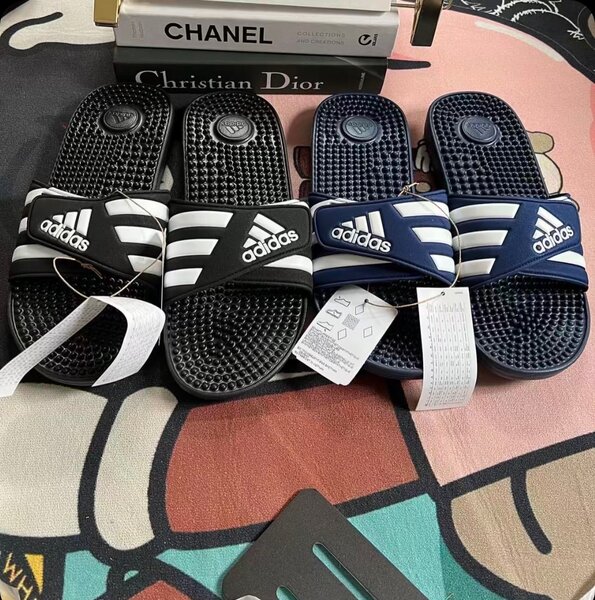 Massaging Adidas slides