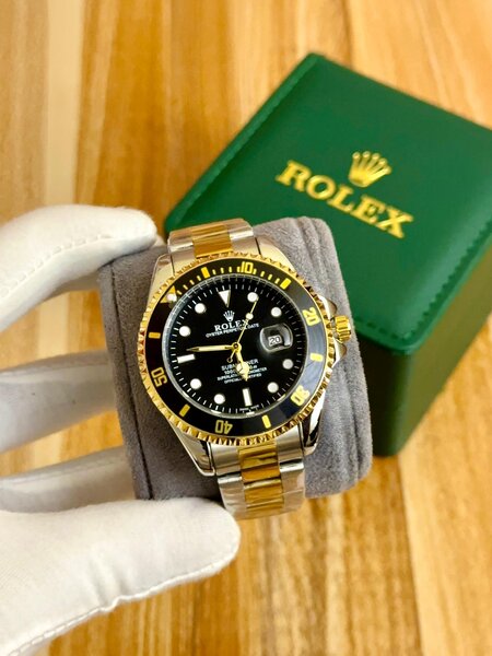 Montre Rolex luxe bicolore