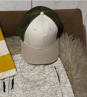 white and olive cap