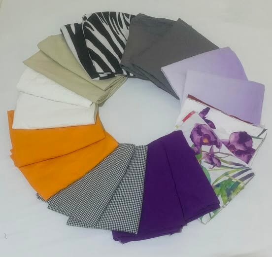 A collection of colored and patterned fabrics: from monochrome to floral and geometric prints