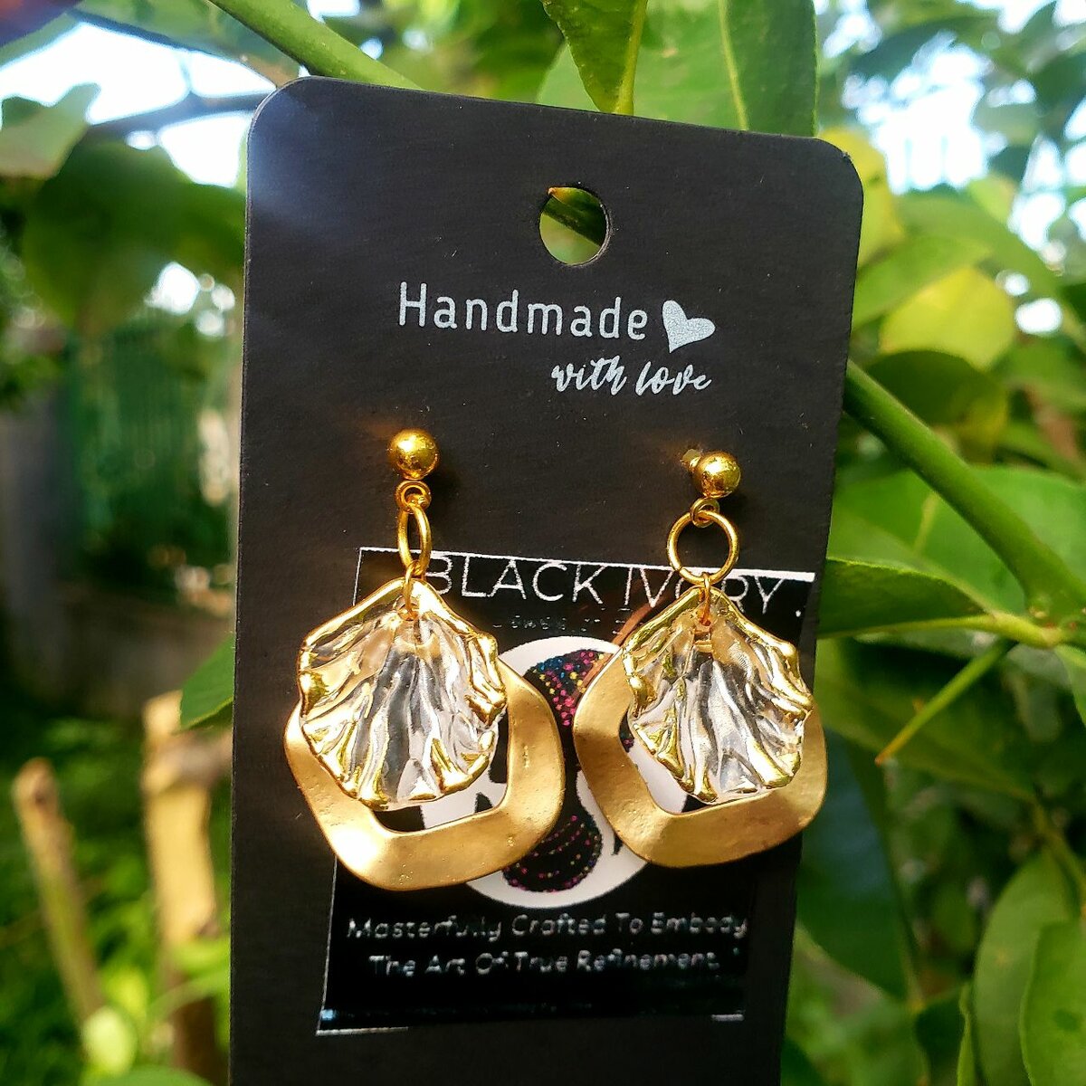 Gold dangling earrings.