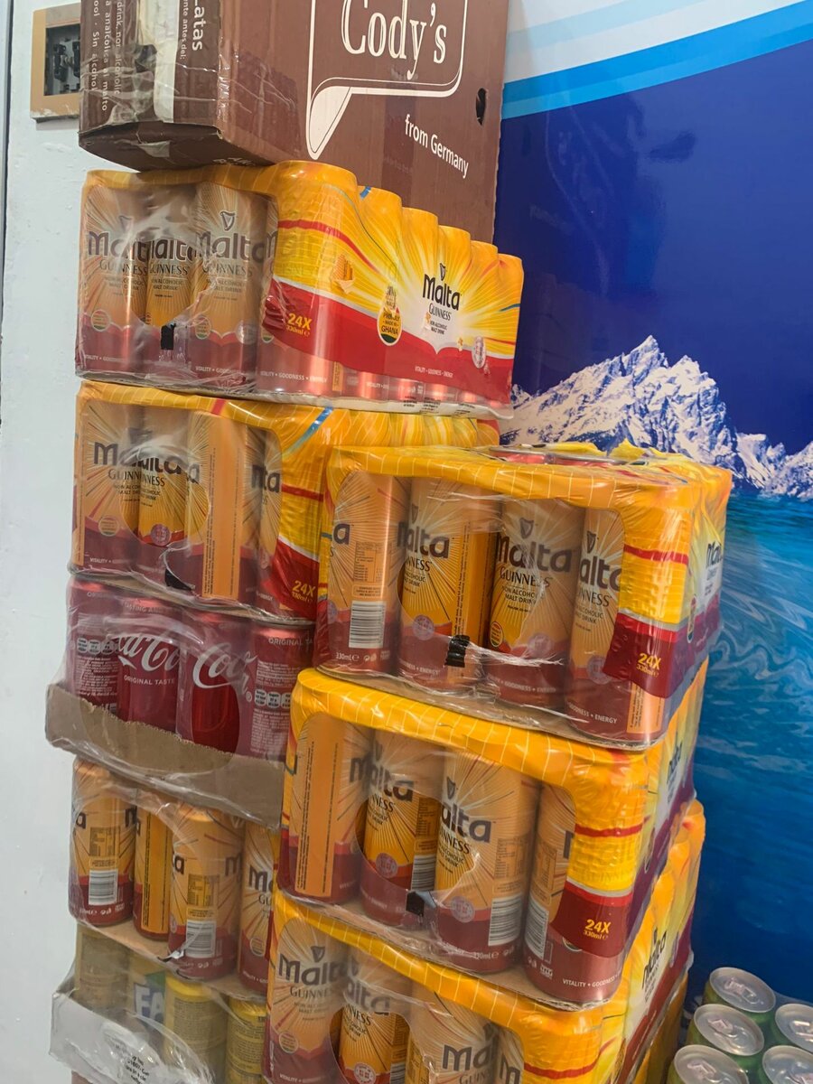 Malta Guinness can and plastic