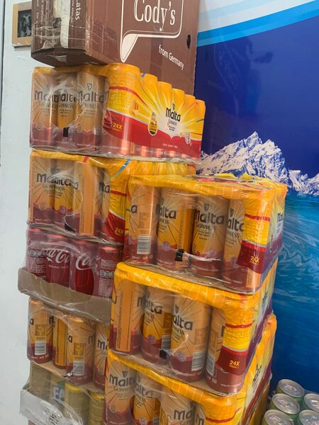 Malta Guinness can and plastic