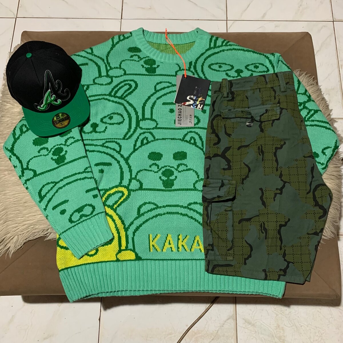 Sweater, cap and side packer shorts