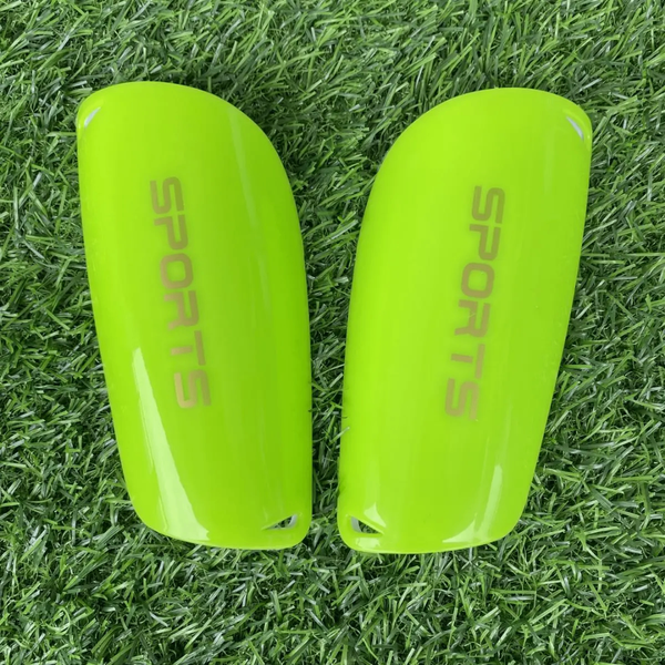 Protège-tibias de football verts