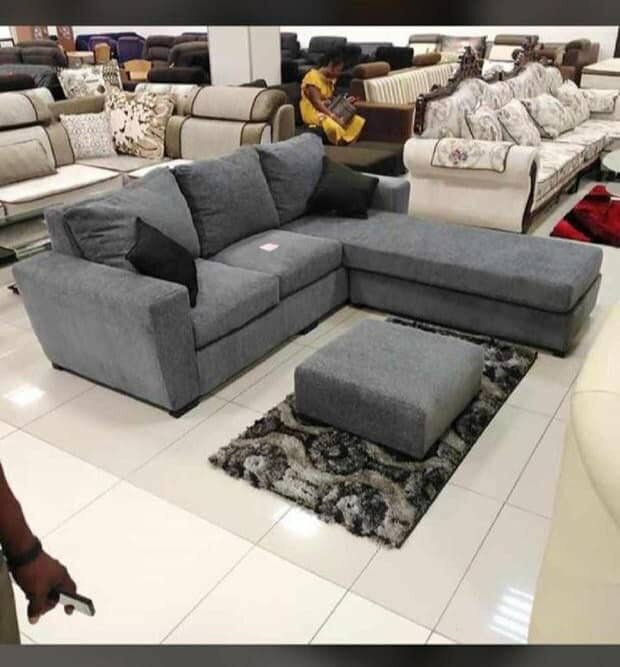 L-couch with throw pillows and footrest