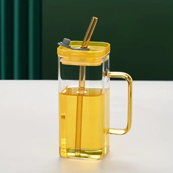 Glass cup with straw