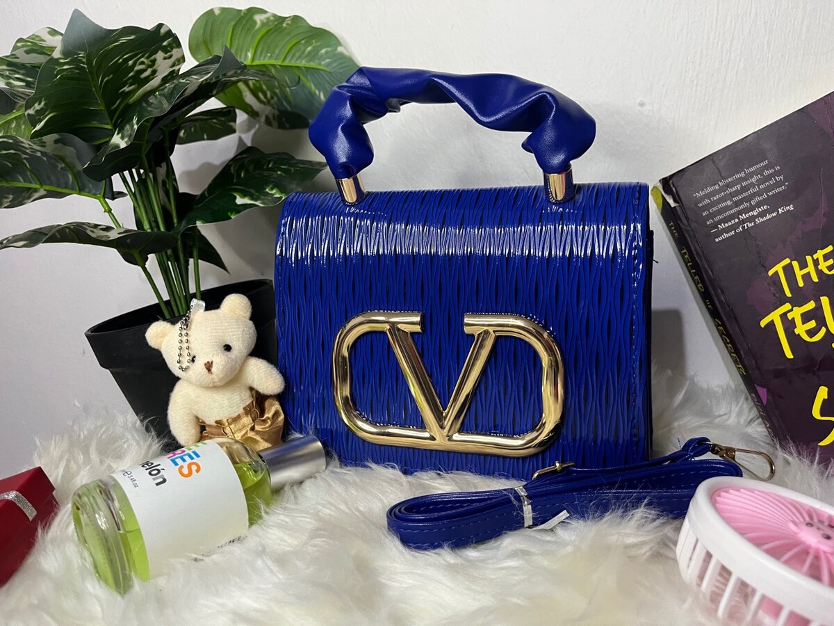 Ladies blue bag with long strips