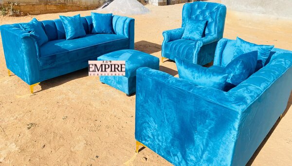 A set of furniture, sofas, an armchair and an ottoman with blue upholstery
