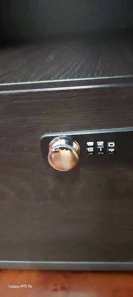 Executive table with a lockable safe using codes.