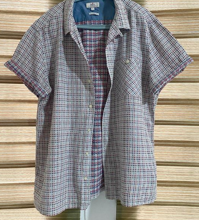 a shirt in a small cage