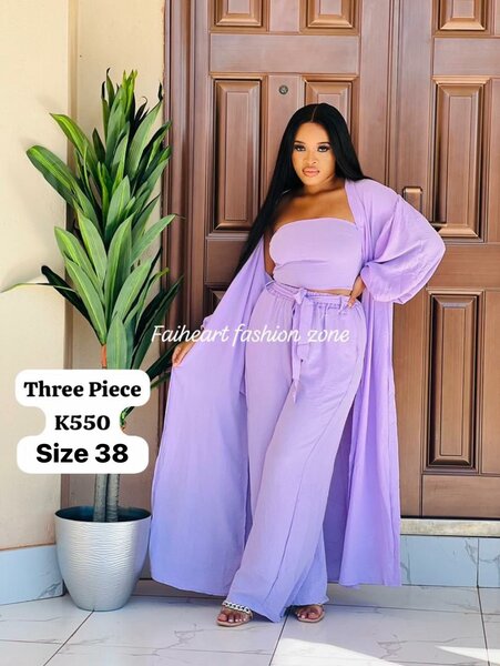 Women's suit, lilac short sleeveless top, pants and long cape