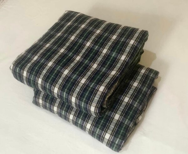Classic plaid bed sheet with green, white and blue shades