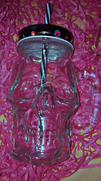 Glass jar with straw