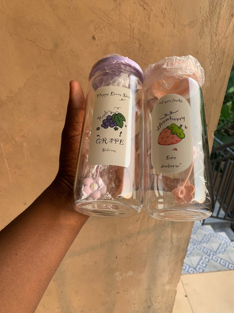 Glass bottle with straw