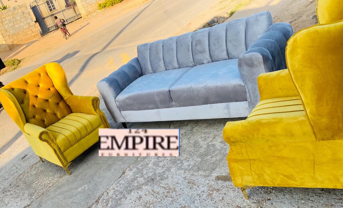 A set of furniture, a gray sofa and yellow armchairs