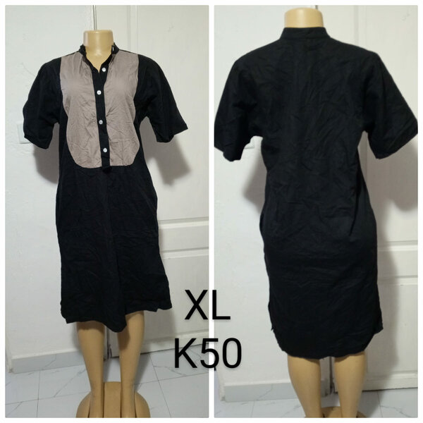 Women's dress is black , size XL