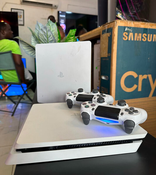 PS4 White Console . 5games installed . One Wireless Gamepad